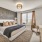 large primary bedroom with neutral furnishings 