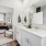 Primary bathroom with double vanity and natural light